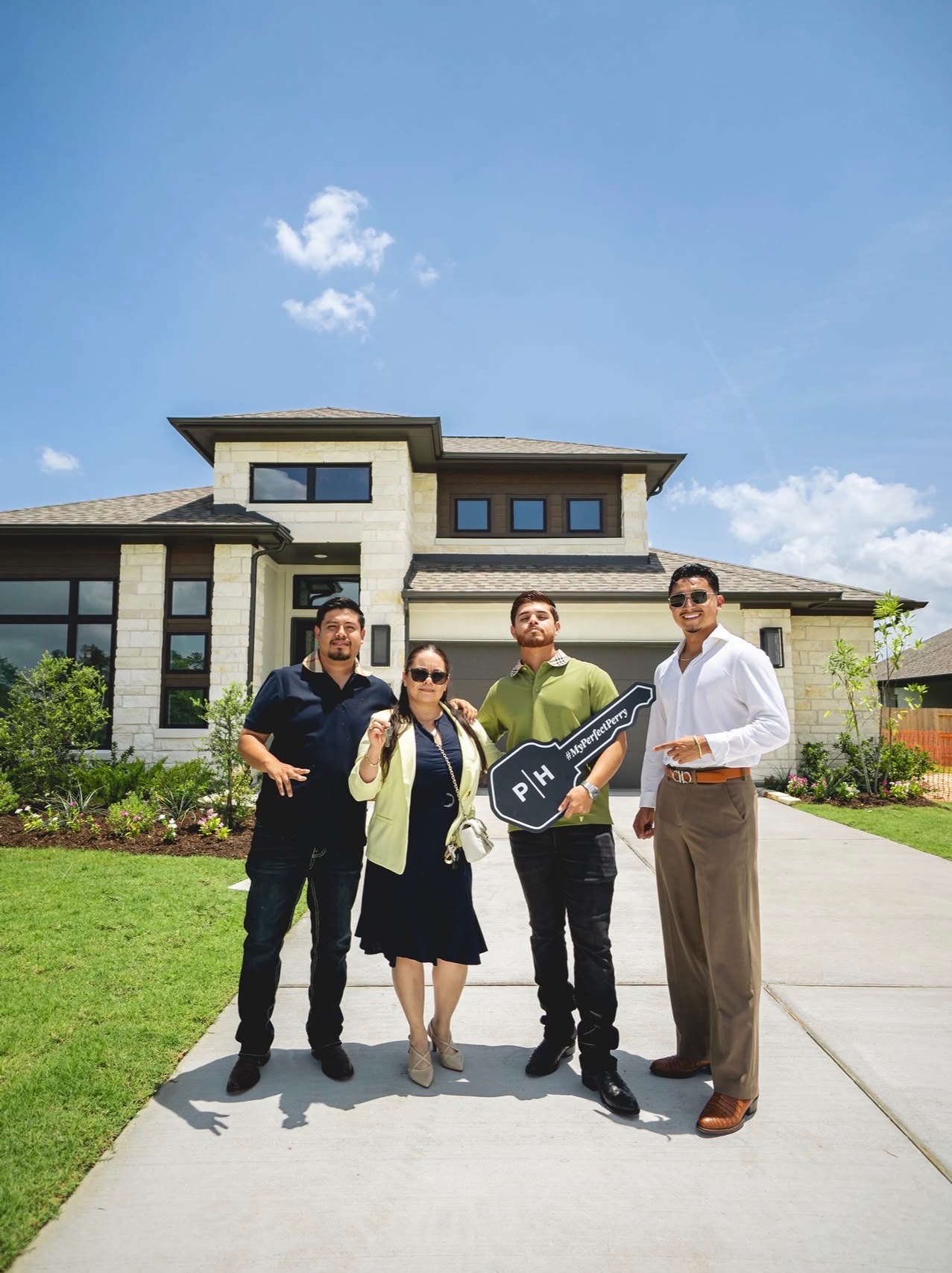 Closing day in front of a new Houston home